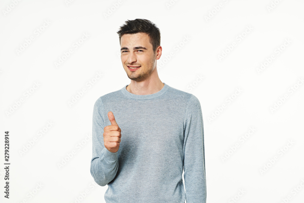 young man with thumbs up gesture isolated on white young man with thumbs up gesture isolated on white