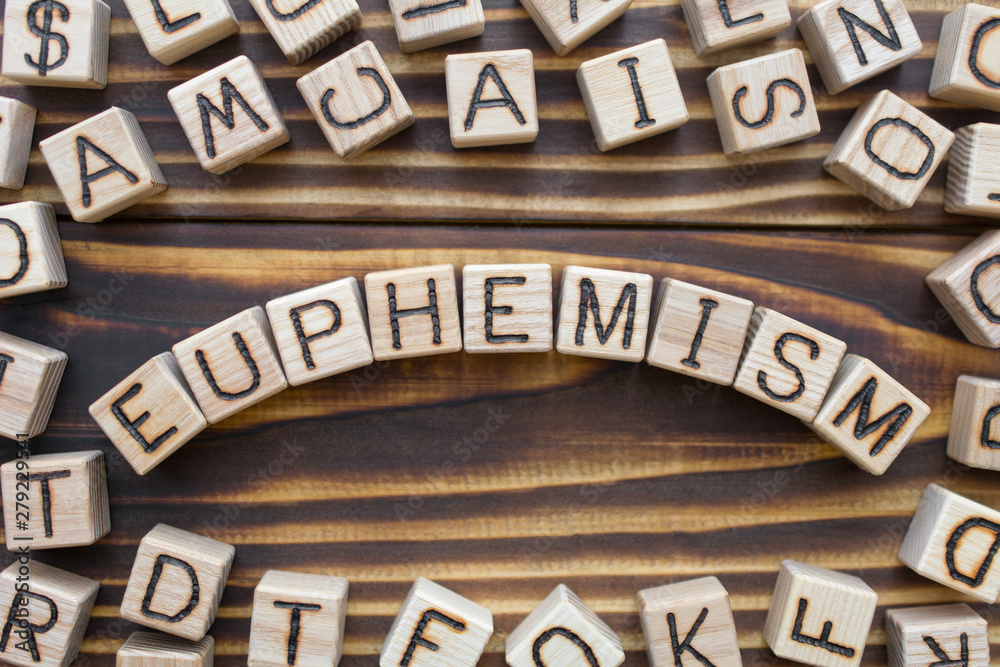 euphemism wooden cubes with letters, polite term to replace obscene or unpleasant concept, around the cubes random letters, top view on wooden background euphemism wooden cubes with letters, polite term to replace obscene or unpleasant concept, around the cubes random letters, top view on wooden background