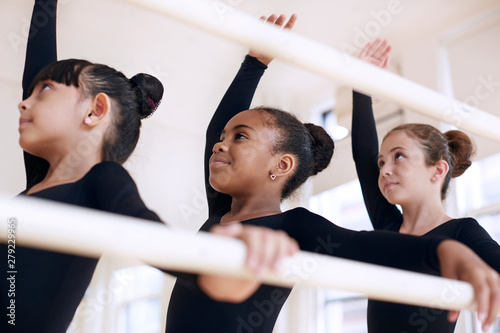 Child ballet dancers practicing in studio
