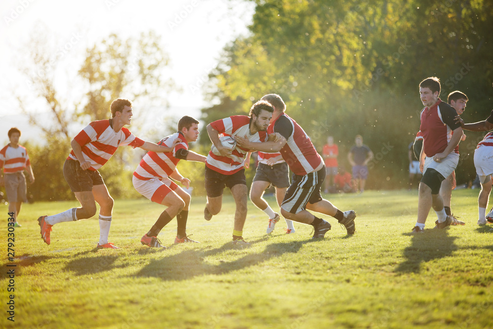 Fototapeta premium Rugby team tackling during scrimmage