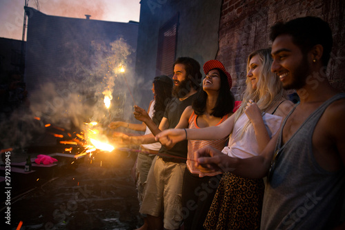 Friends holding sparklers