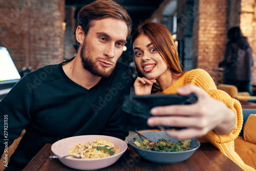 young couple having dinner in restaurant