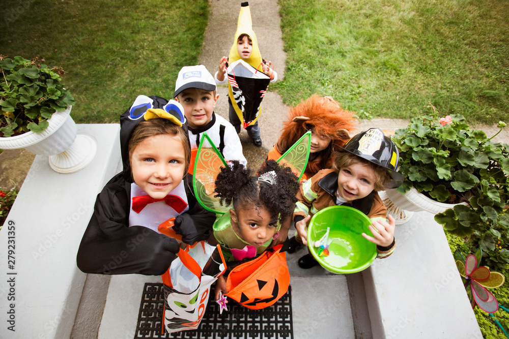 Fototapeta premium Portrait of children in fancy dress costumes on Halloween