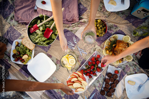 Friends having picnic on rooftop