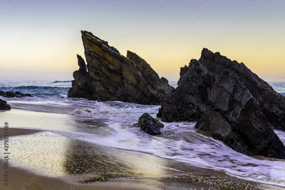 Beautiful sandy beach with rocks on Atlantic coast, Portugal