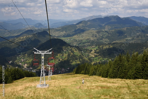 Travel with a chairlift in the Carpathian Mountains (Romania).