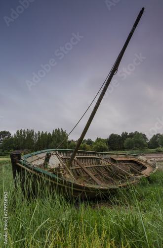 abandoned boat in the brush