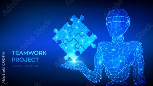 Teamwork. Puzzle elements. Team metaphor. Symbol of teamwork, cooperation, partnership. Abstract 3d low polygonal robot holding puzzle pieces. Business concept of of connecting. Vector Illustration.