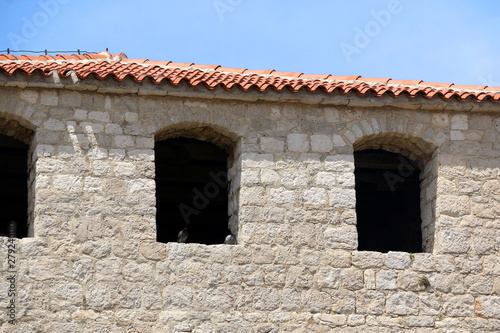 Architectural detail of historical Skrivanat Tower in town Pag, on island Pag, Croatia.