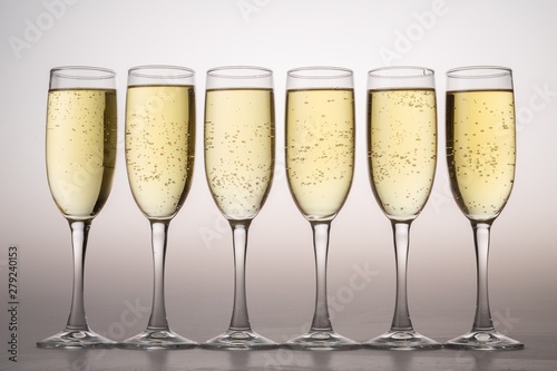 Six Champagne Glasses on Grey Background