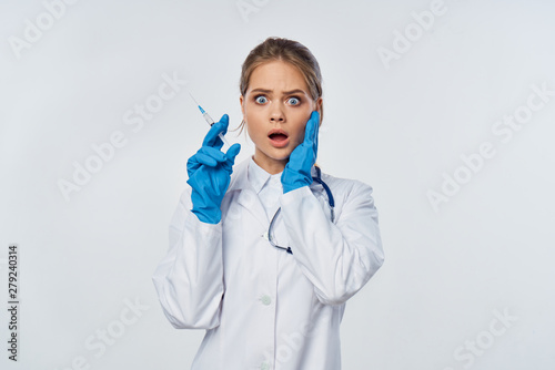 young female doctor with syringe photo