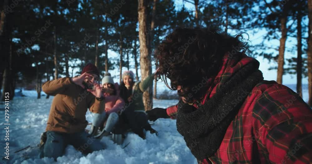 Multi ethnic friends young tourist take a camera and make a funny video saying hello in front of the camera enjoying the time in a winter time at nature