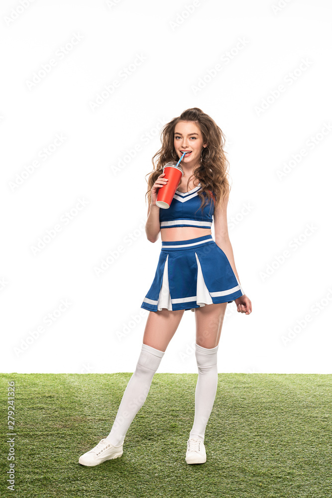 sexy cheerleader girl in blue uniform standing with soda on green field  isolated on white Stock Photo | Adobe Stock