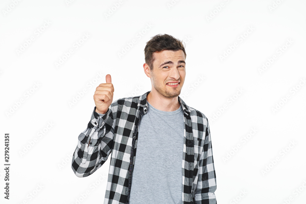 young man with thumbs up gesture isolated on white young man with thumbs up gesture isolated on white