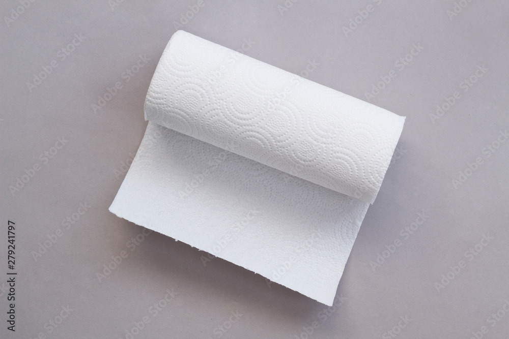 Fototapeta premium Roll of paper towels on table, top view