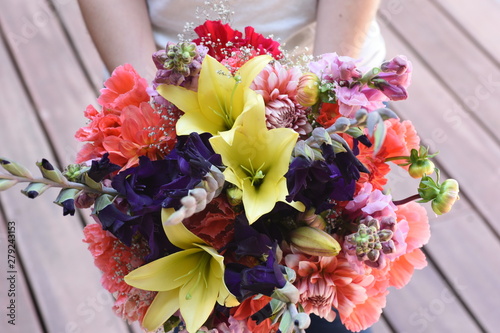 wedding bouquet in young womans hands 