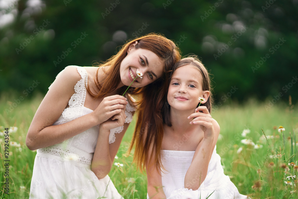 mother and daughter having fun in the park mother and daughter having fun in the park
