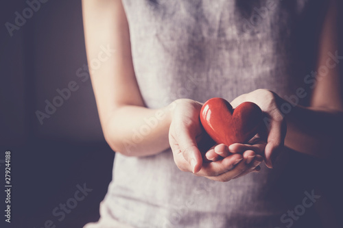 Fototapeta Naklejka Na Ścianę i Meble -  Happy Asian young woman making her hands in heart shape, heart health insurance, social responsibility, donation charity, organ donor concept, gratitude, thankful, be kind concept