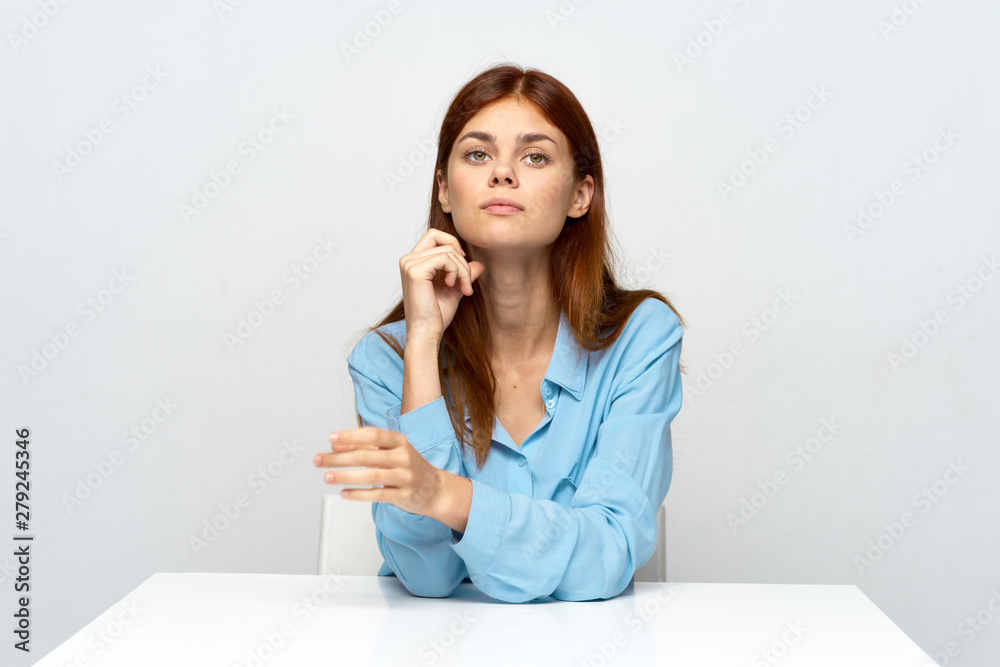 portrait of a young woman sitting on sofa portrait of a young woman sitting on sofa