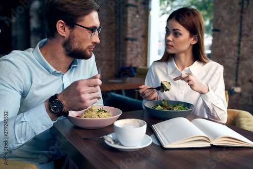 young couple having dinner in restaurant