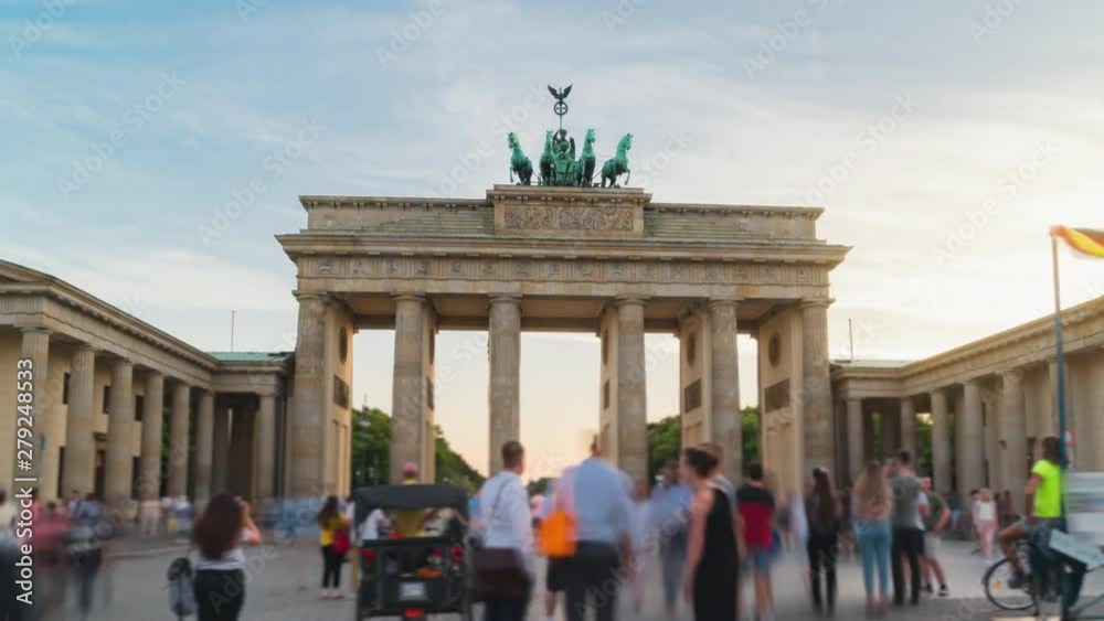 Day-to-night Hyperlapse with a long exposure crowded square with tourists in front of the Brandenburg Gate Berlin Germany