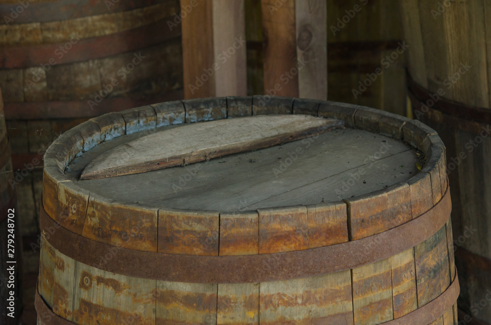 Old dusted wooden barrels used for alcohol Old dusted wooden barrels used for alcohol