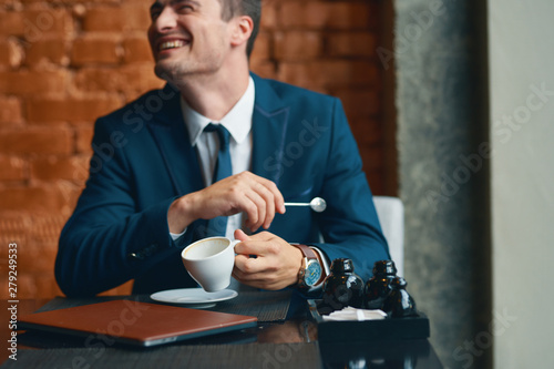 businessman drinking coffee in cafe