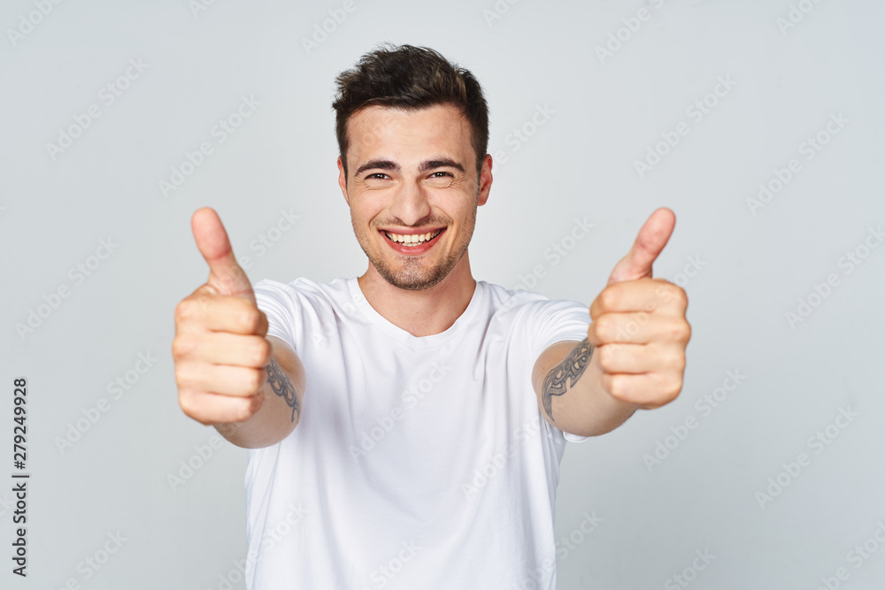 young man with thumbs up young man with thumbs up