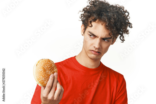 young man with hamburger