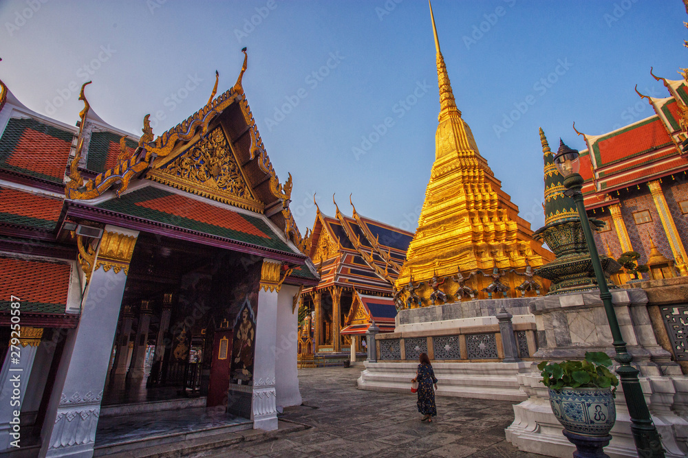 Women tourists are traveling at wat phra kaew.Temple of the Emerald Buddha, Bangkok, Thailand