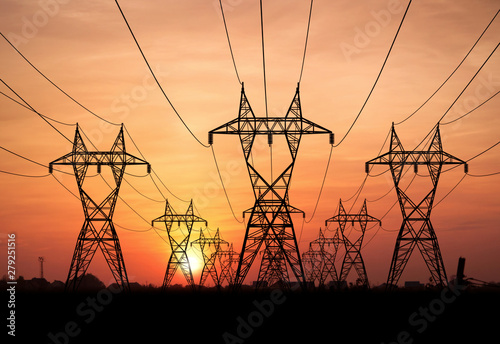 Canvas Print electricity pylons at sunset
