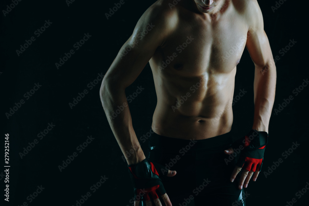 Naklejka premium muscular man in studio