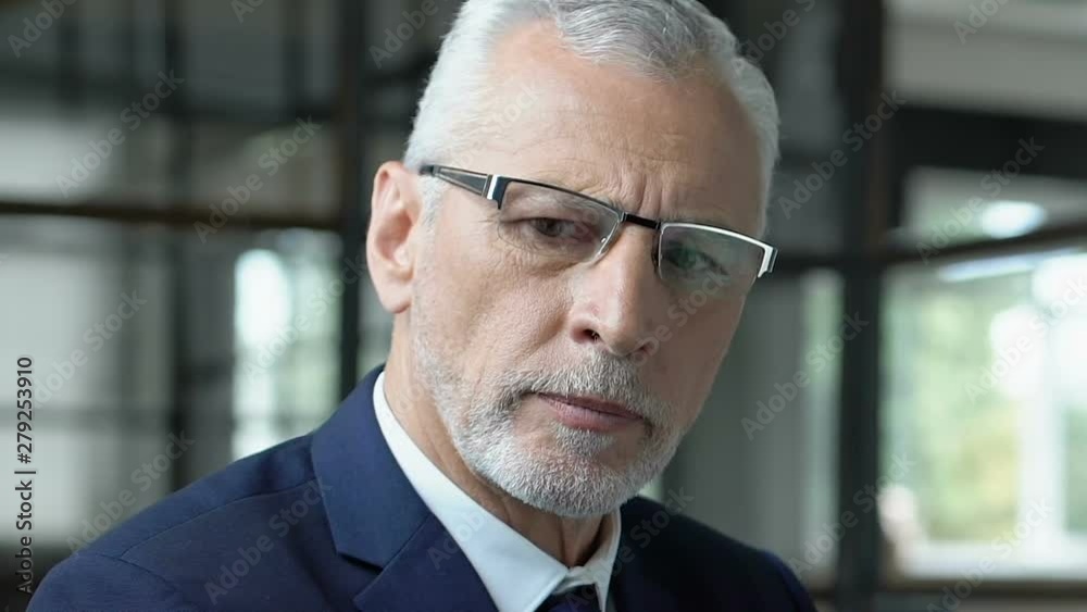 Senior businessman considering startup strategy, planning difficult project Senior businessman considering startup strategy, planning difficult project