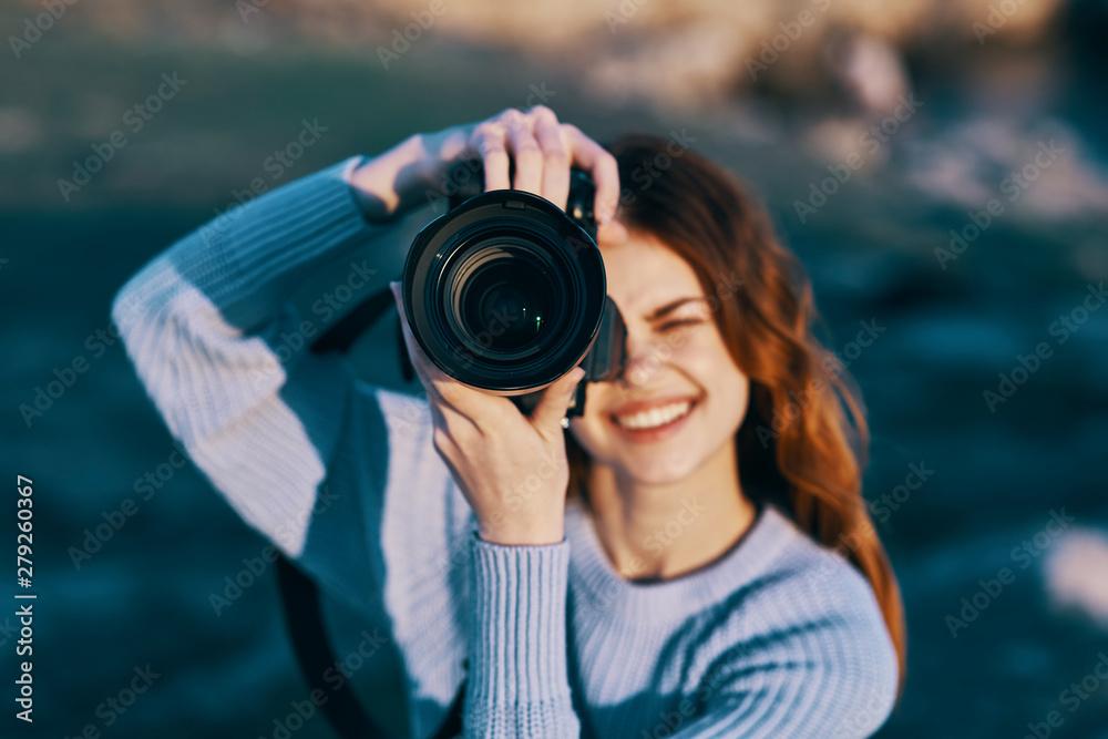 woman taking photo with digital camera woman taking photo with digital camera