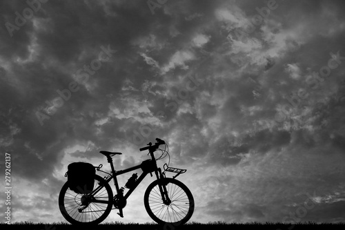 silhouette vintage bike on sunrise