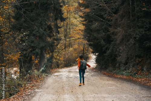 young woman walking in the forest