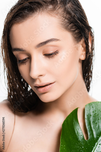 beautiful wet nude young woman with green leaf with water drops isolated on white
