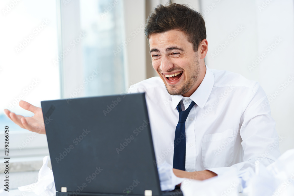 portrait of a businessman working on laptop