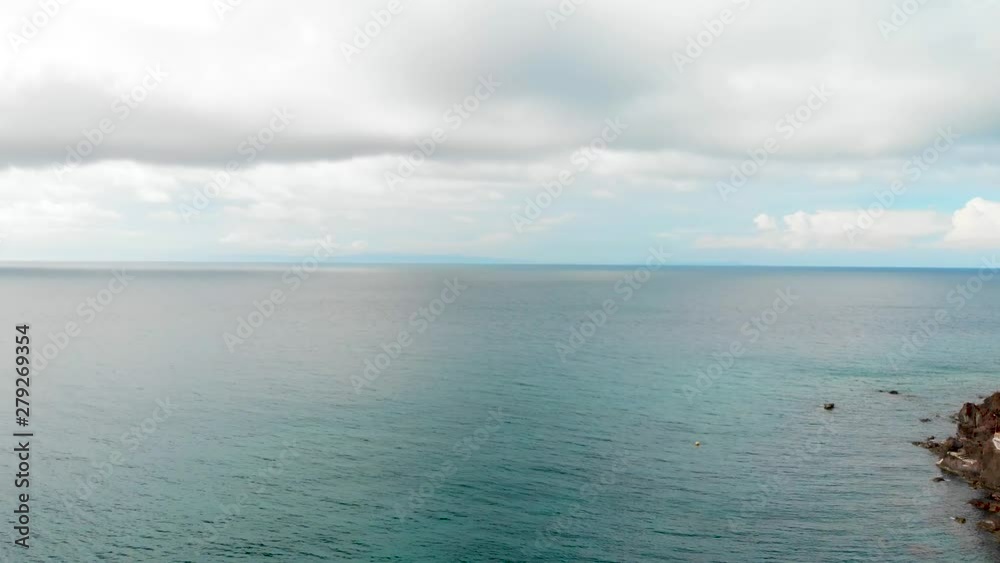 aerial drone shot passing exotic rocky island tropical paradise with palm trees in Asia to open blue ocean 4k horizon aerial drone shot passing exotic rocky island tropical paradise with palm trees in Asia to open blue ocean 4k horizon