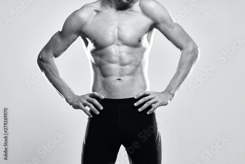 muscular man posing in studio on black background