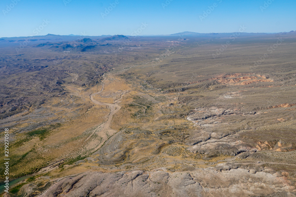  Aerial view of desert next the Lake Mead in Mohave County, Arizona, United States. Arid endless desert during hot summer season