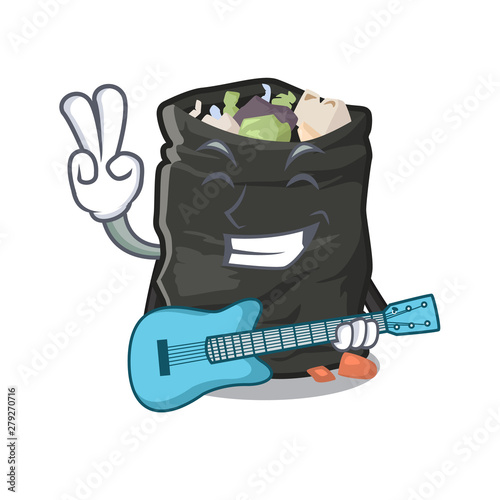 With guitar cartoon garbage bag next to table