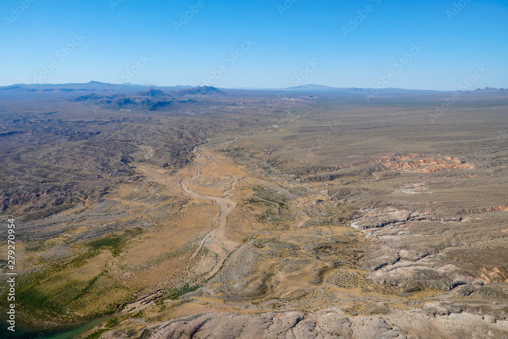  Aerial view of desert next the Lake Mead in Mohave County, Arizona, United States. Arid endless desert during hot summer season