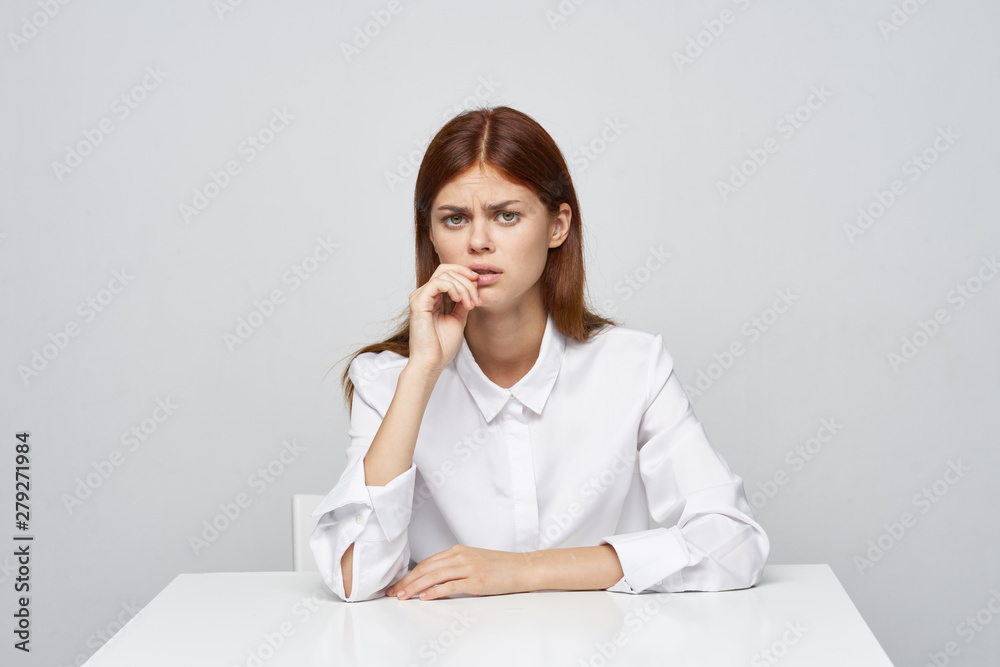portrait of a young woman sitting on sofa portrait of a young woman sitting on sofa