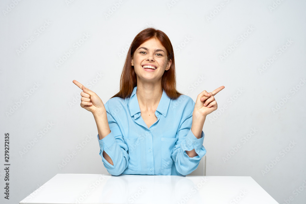 young woman pointing at copyspace young woman pointing at copyspace