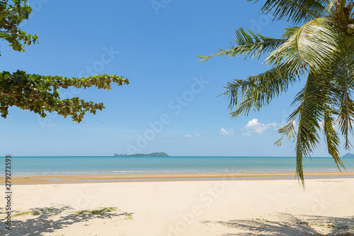 Beautiful sandy beach with coconut trees And small islands in the sea. Beautiful beaches in southern Thailand.