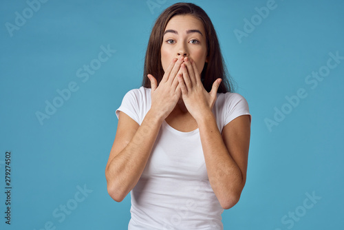 young woman covering mouth with her hands