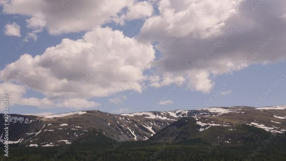 Timelapse view of fast moving clouds over the mountains Timelapse view of fast moving clouds over the mountains