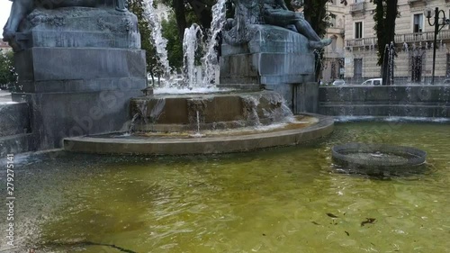 Turin, Piedmont, Italy. July 2019. Filmed with tilt movement on the Angelica fountain in Piazza Solferino. The statues that compose it symbolically recall the four seasons. 30fps photo