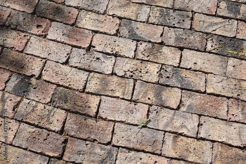 Ancient brick walkway with rough irregular shaped bricks